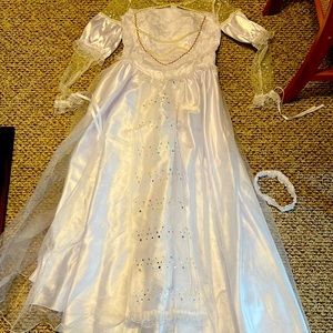 This is a Costume Wedding Dress. It comes with a Garter Belt.